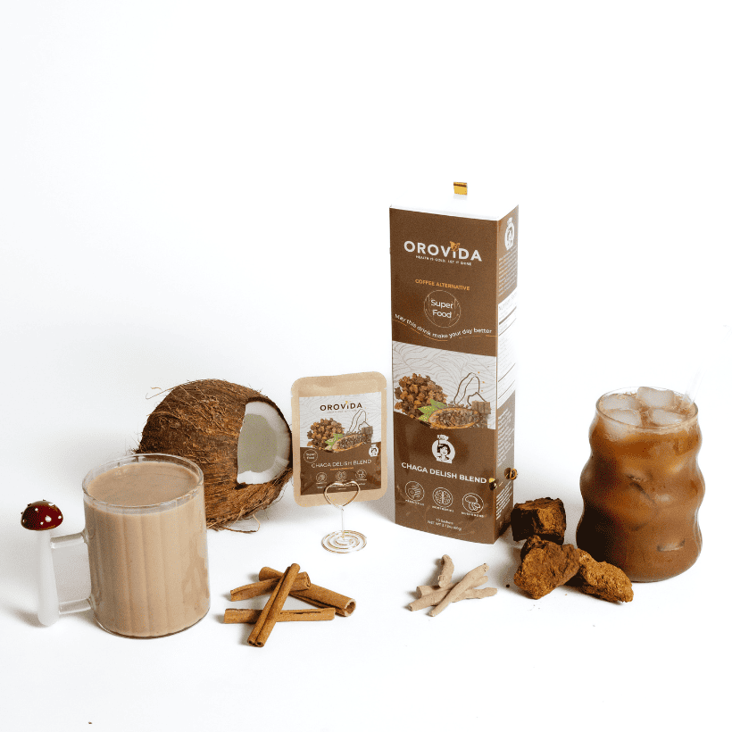 Orovida product packaging with a mug of a creamy beverage, coconut, cinnamon sticks, and more on a white background.